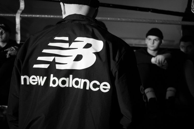 man in black and white adidas jacket