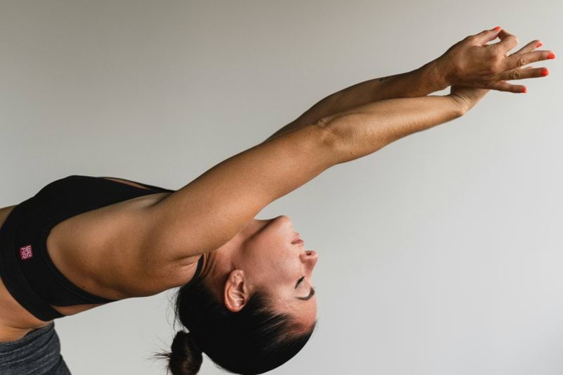 woman stretching arms