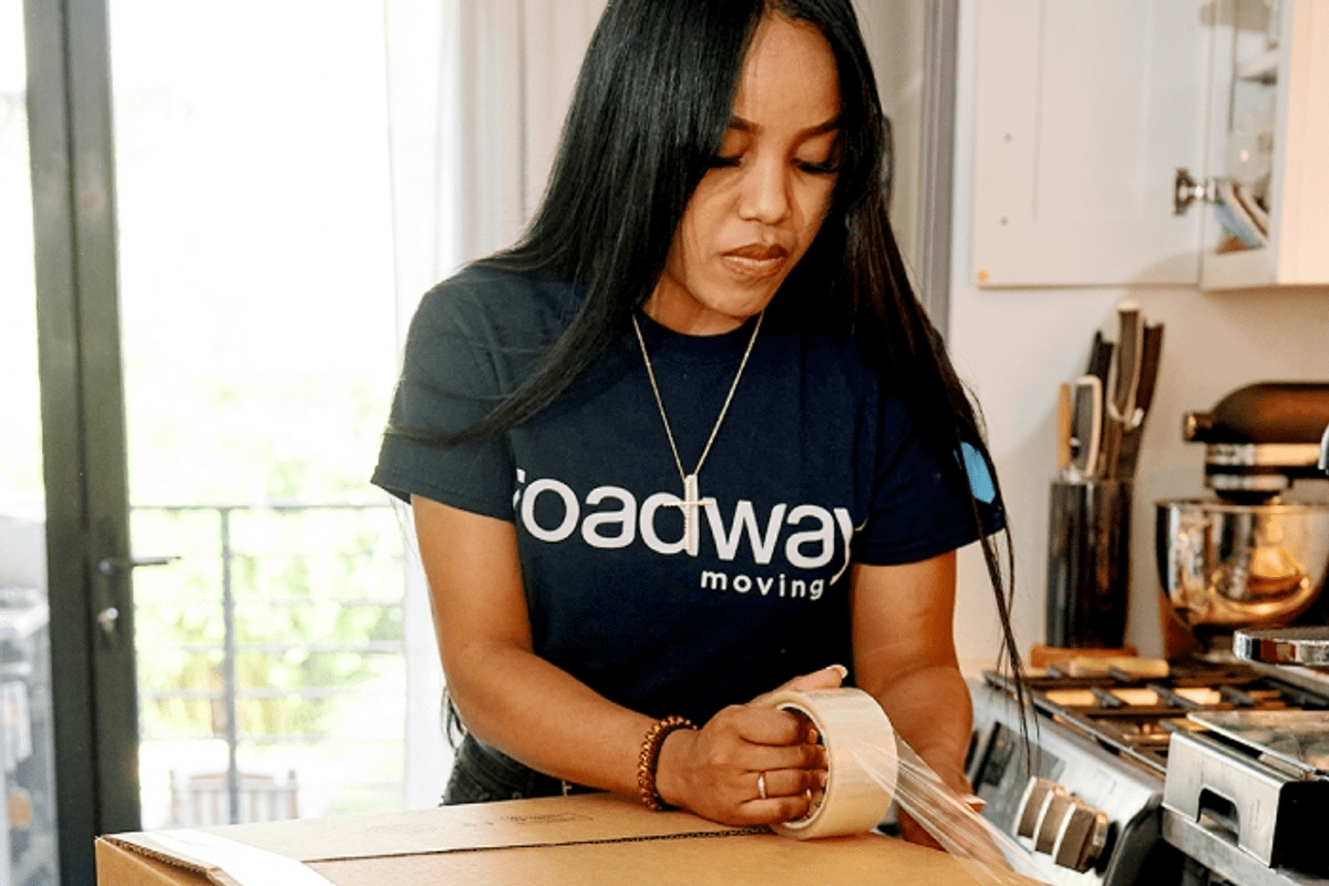 Roadway Moving's mover packing items during a move