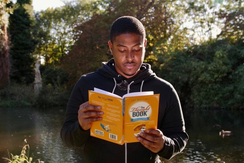man reading book