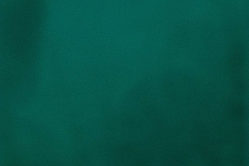 Solid dark teal background with subtle lighting.