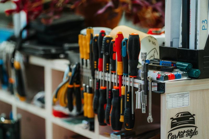 a bunch of tools that are on a shelf