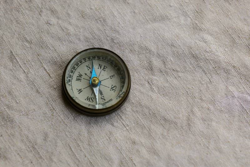 silver and black round analog watch