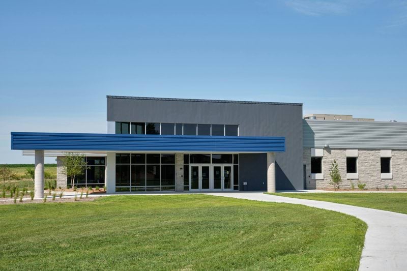 a large building with a blue awning on top of it