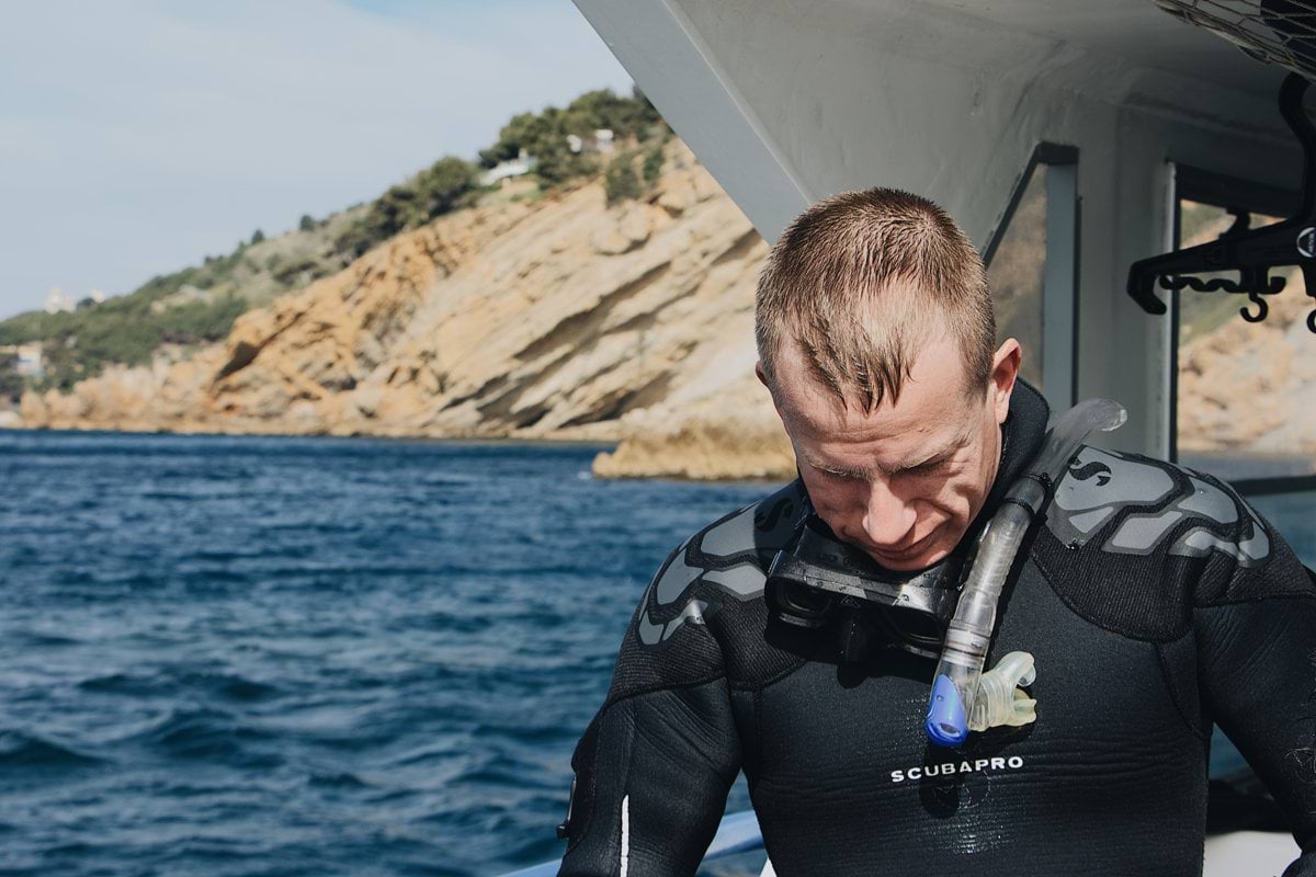 man wearing wet suit