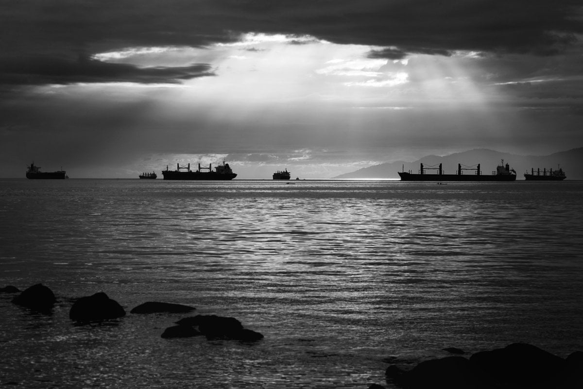 grayscale photo of ships on water