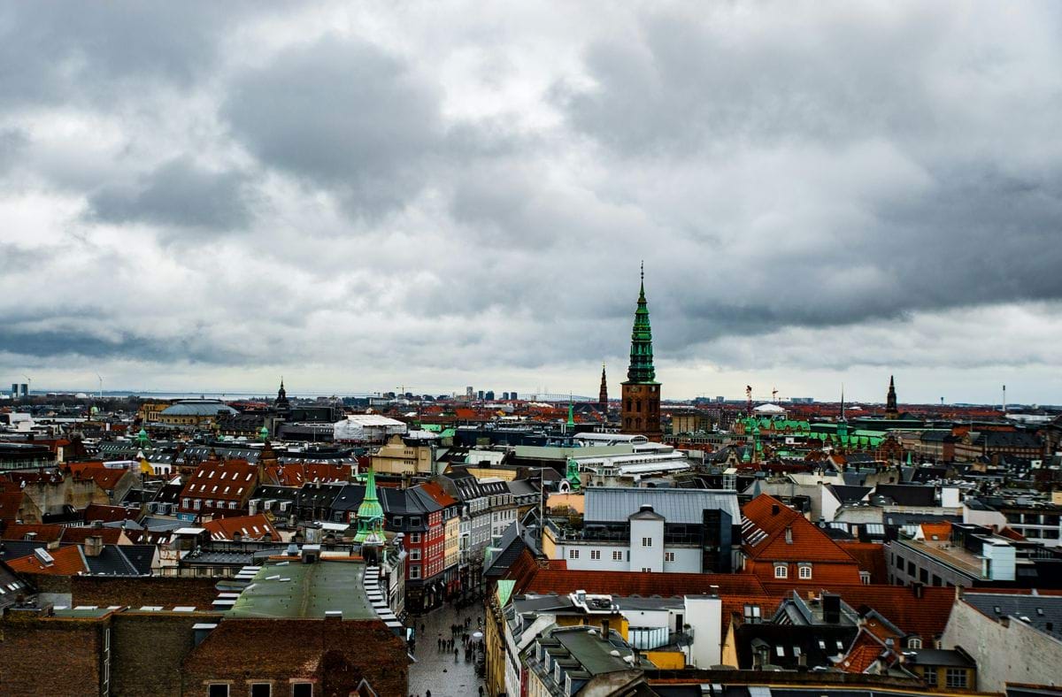 aerial view of city buildings under cloudy sky during daytime