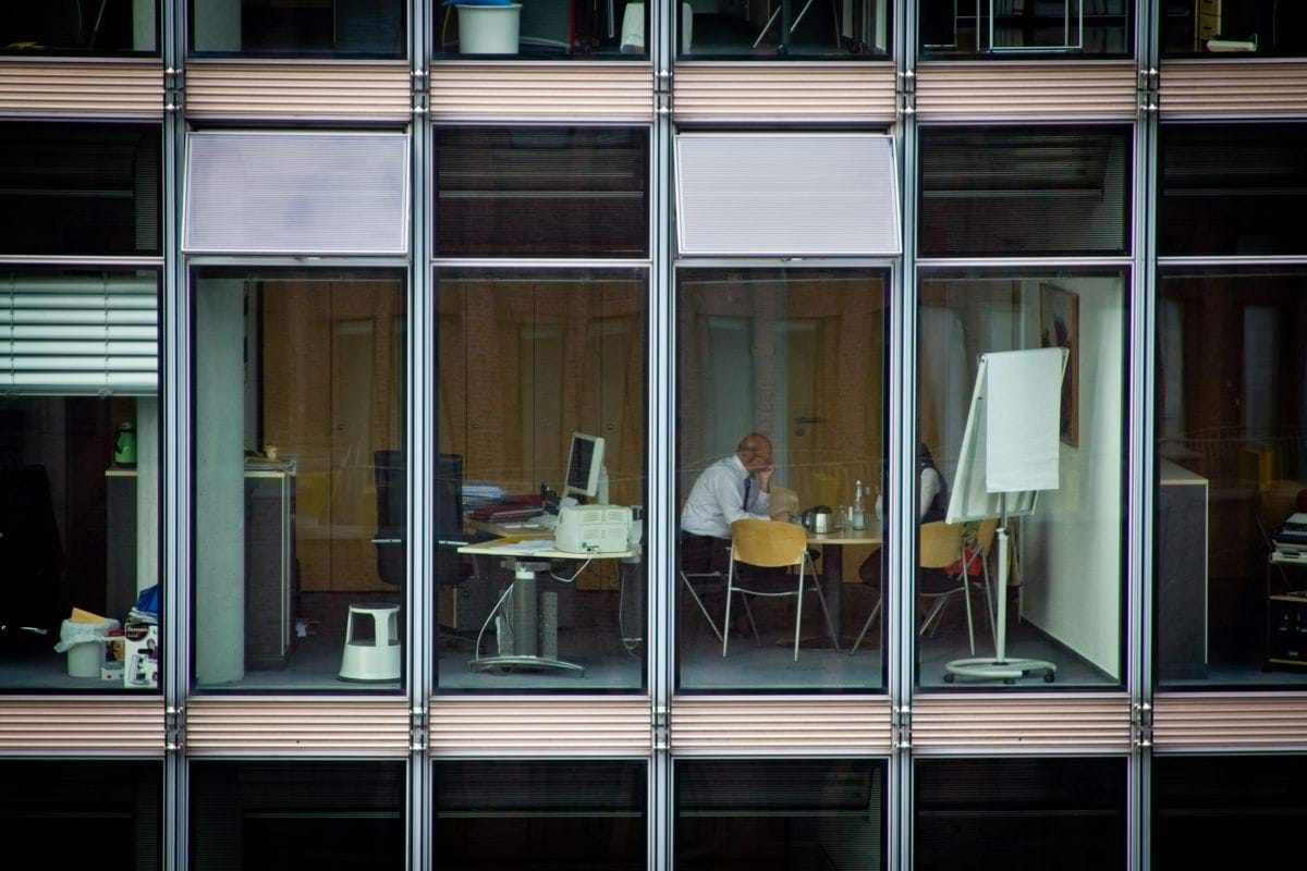 man sitting on chair inside room
