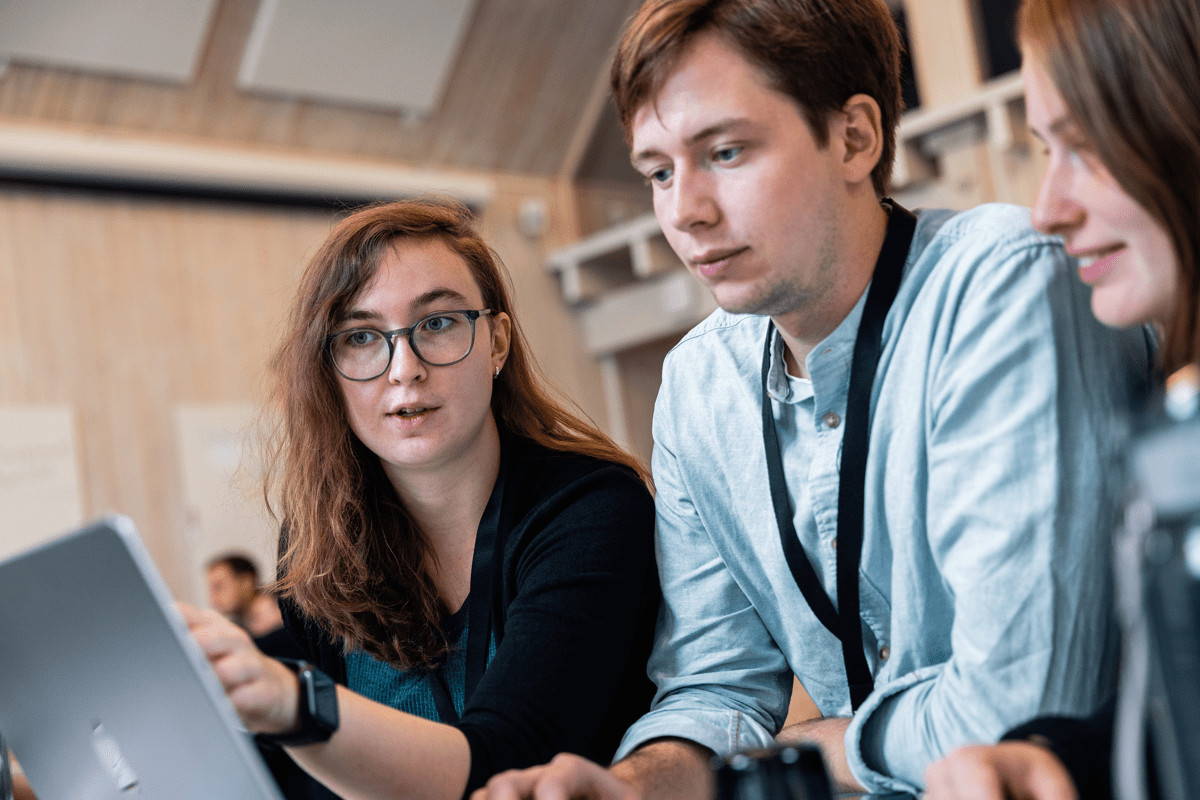 three people discussing code