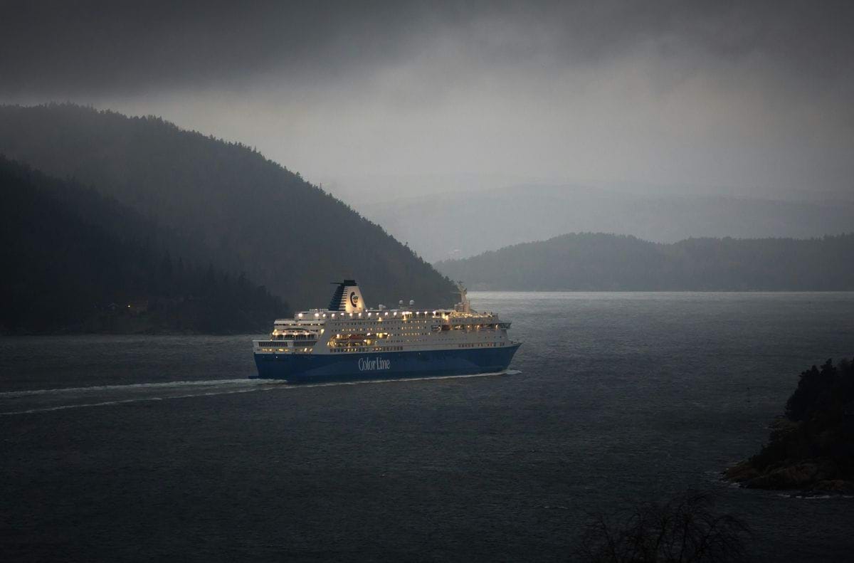 luxury ship on body of water near islands