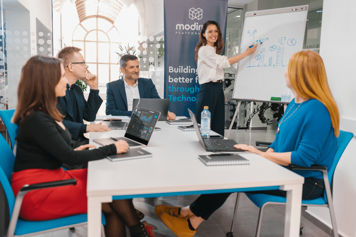 discussing data in meeting room