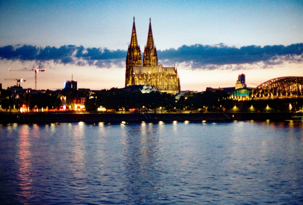 City skyline with cathedral at dusk reflected in water