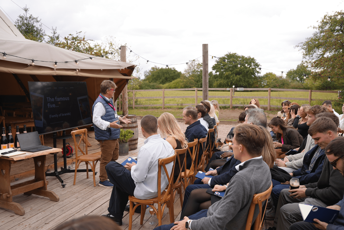 Apprentify CEO addressing employees during partner brand integration event