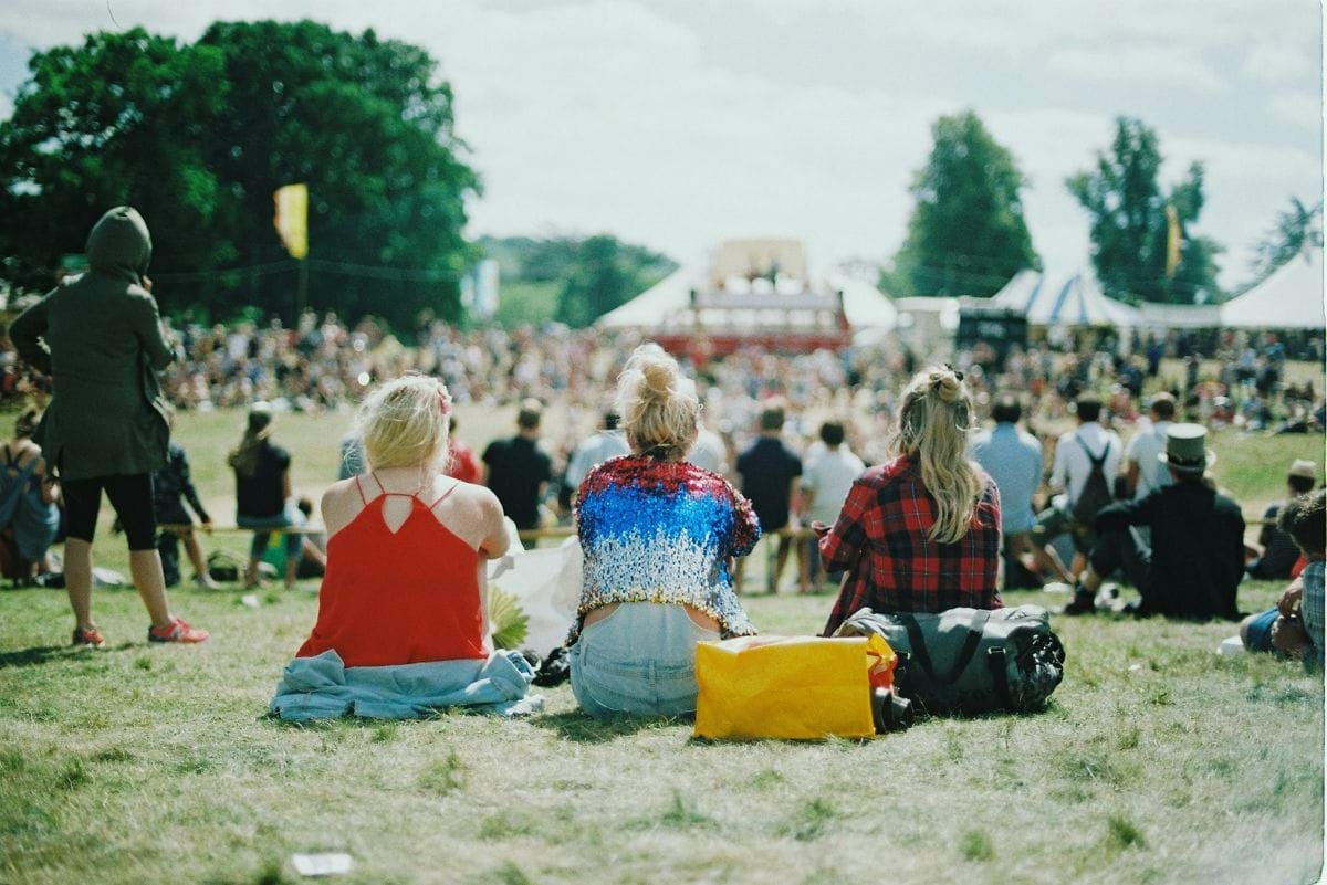 group of people on grass field under sunny day