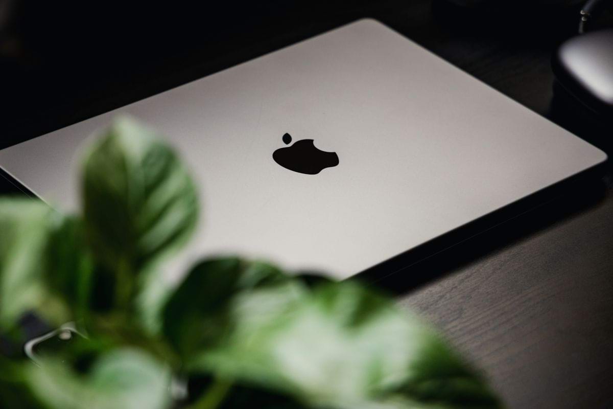 a black apple on a white tablet