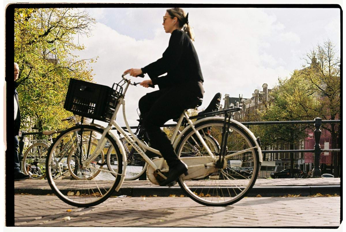 Woman riding a bicycle with a basket