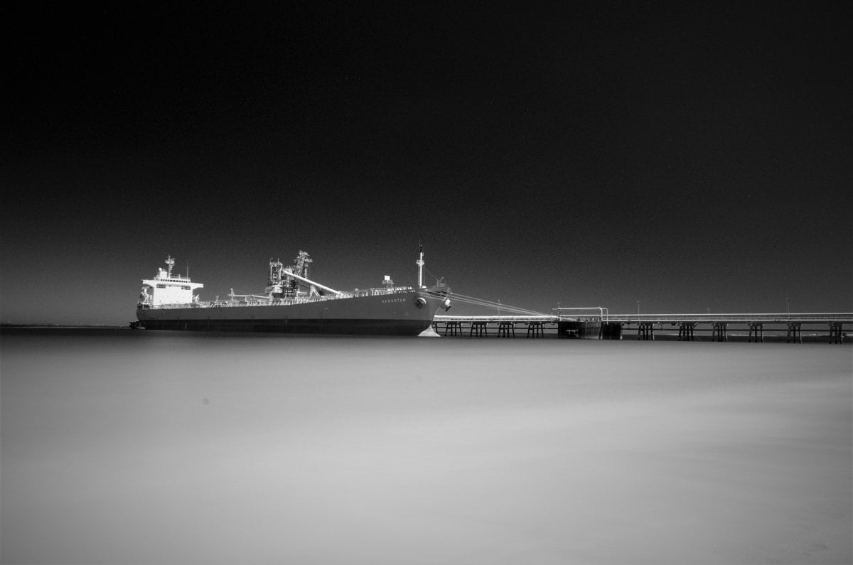 a large boat sitting on top of a body of water