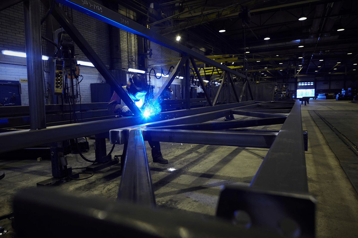 Welder working on a steel frame