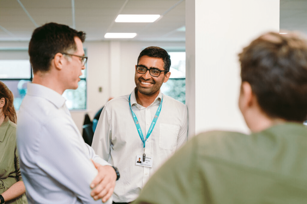 Colleagues chatting in an office