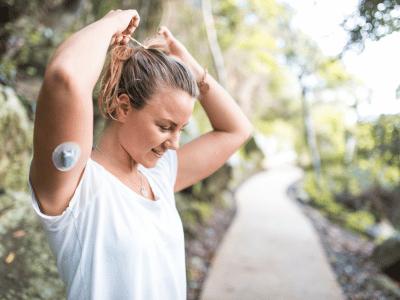 Woman putting her hair into a ponytail