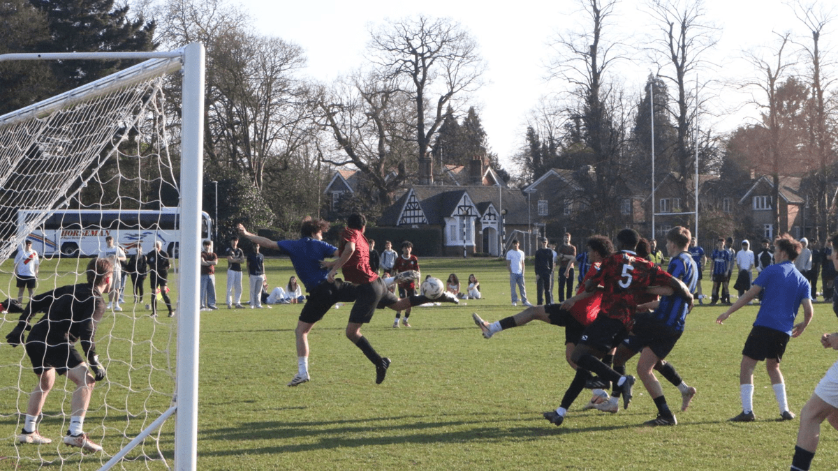 male students playing rugby
