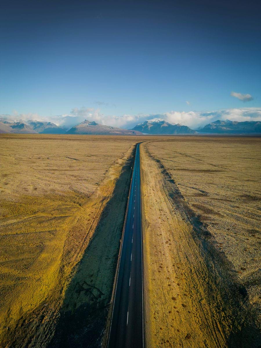 An aerial view of a road in the middle of nowhere