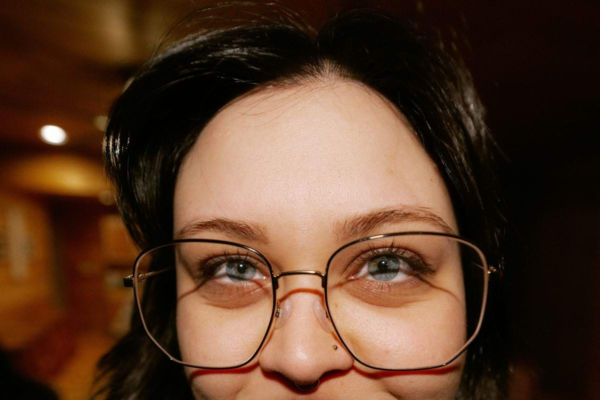 Close-up of a woman wearing large glasses