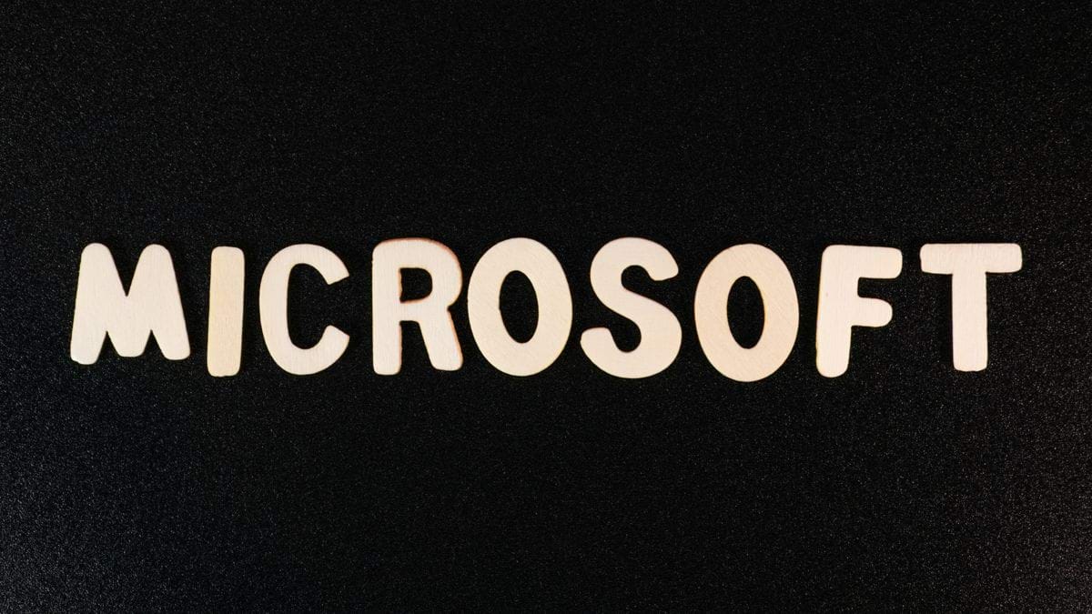 the word microsoft spelled with white letters on a black background