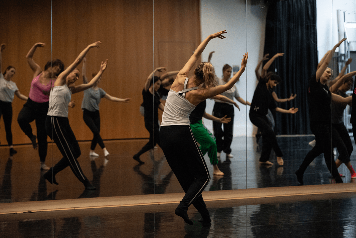 Group of adults dancing in a studio