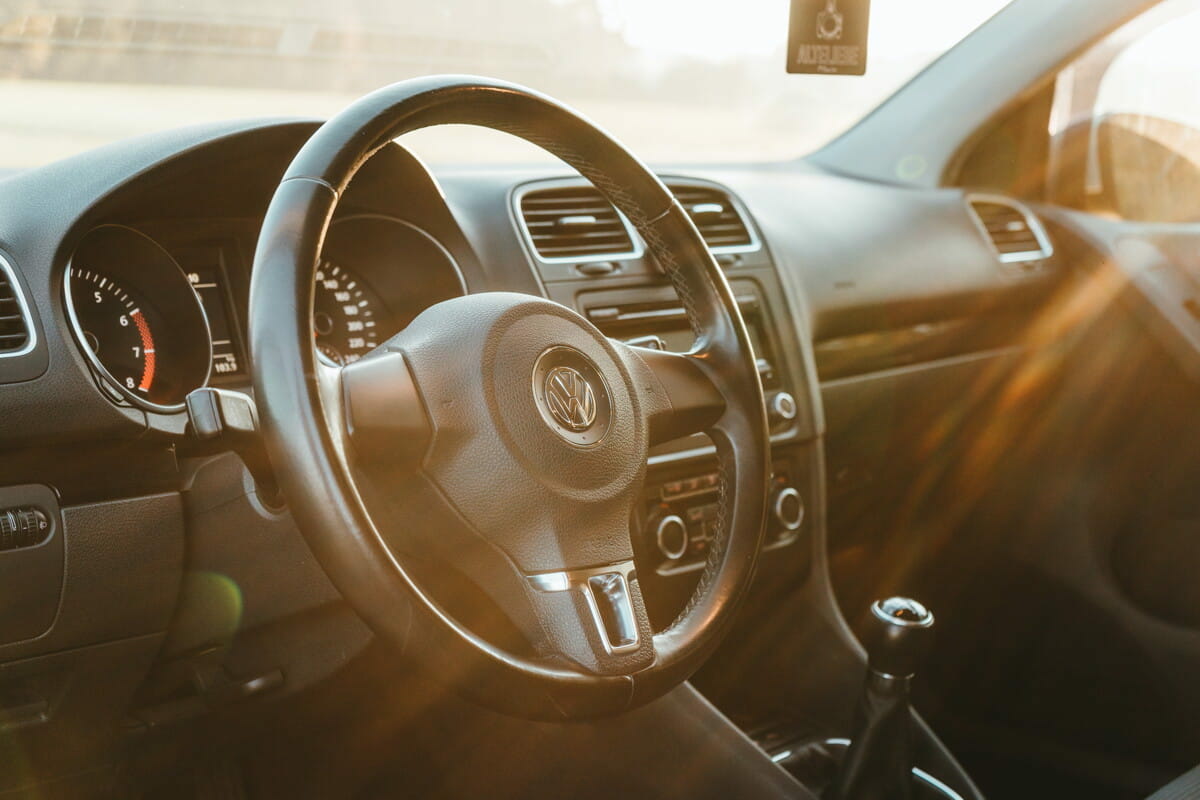 sunlight piercing through Volkswagen steering wheel