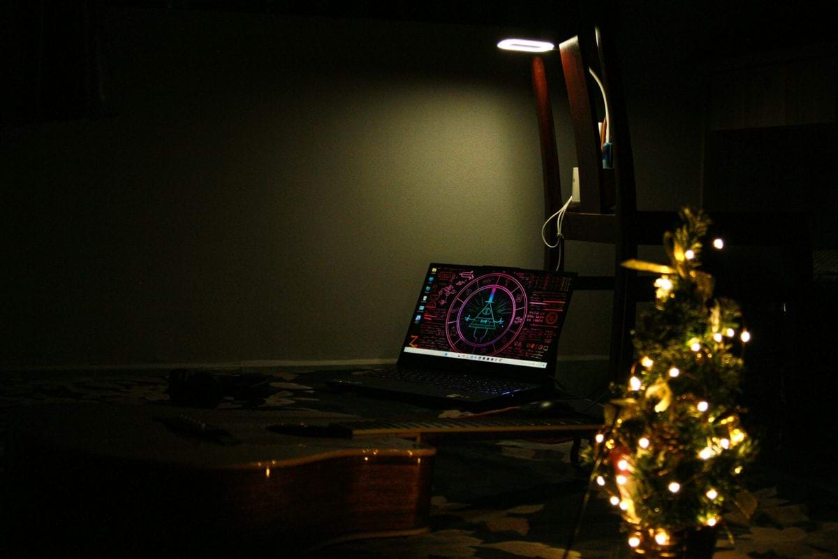 a laptop computer sitting on top of a desk