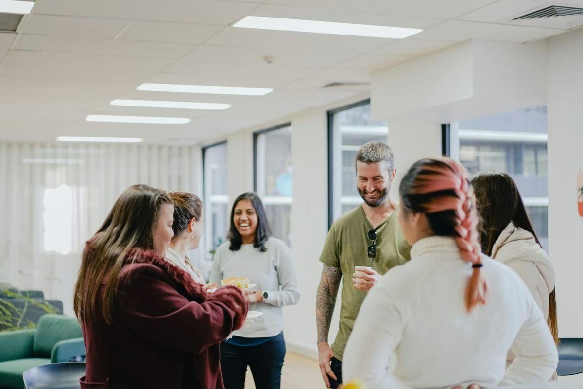 a group of people standing in a room