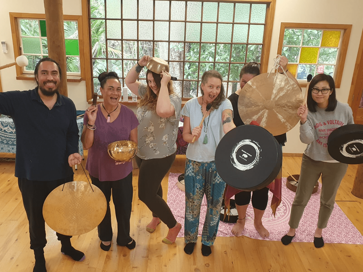 Sound healing students having fun with their instruments