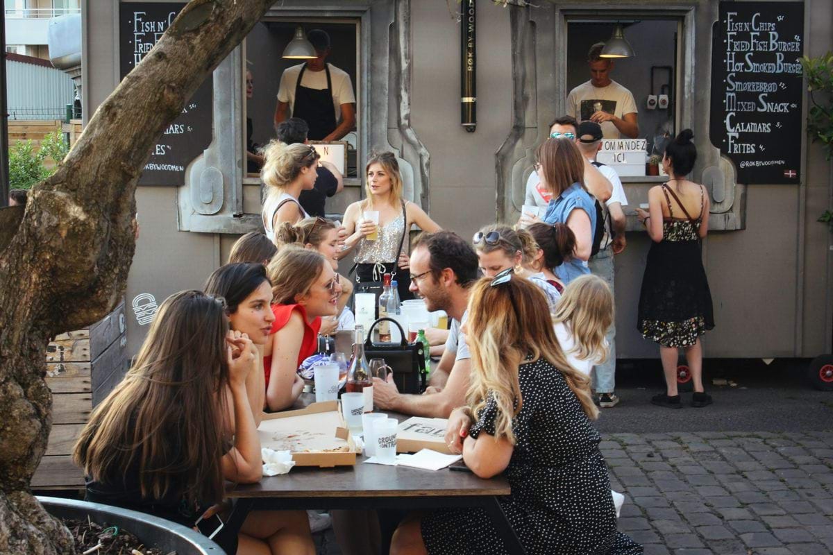 people sitting on chair in front of table