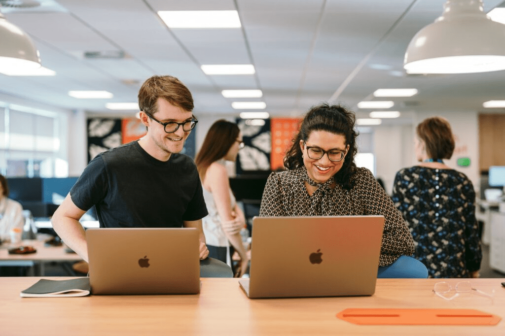 Colleagues collaborating in an open work space