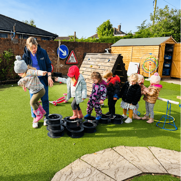 Children playing outside at nursery