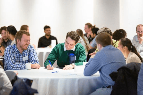 Group of young professionals collaborating at the 2024 Young Professionals Summit in Vancouver, BC