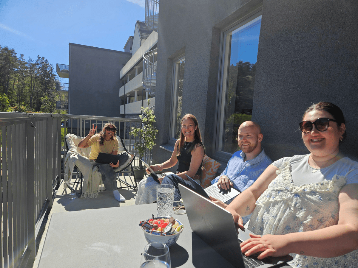 A group of people working on a balcony