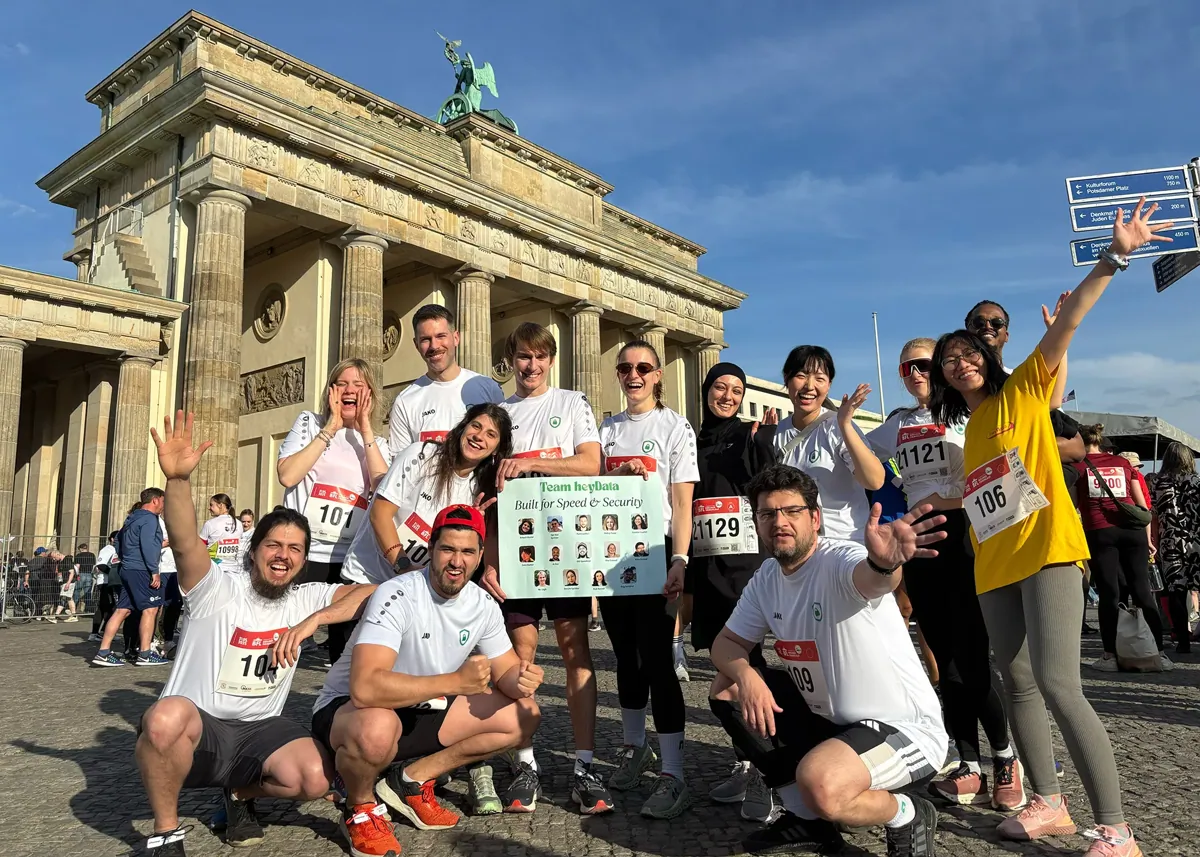 A group of colleagues posing in front of the Brandenburg Gate during a team outing.