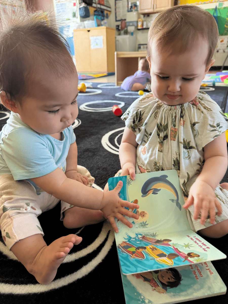 infants looking at books