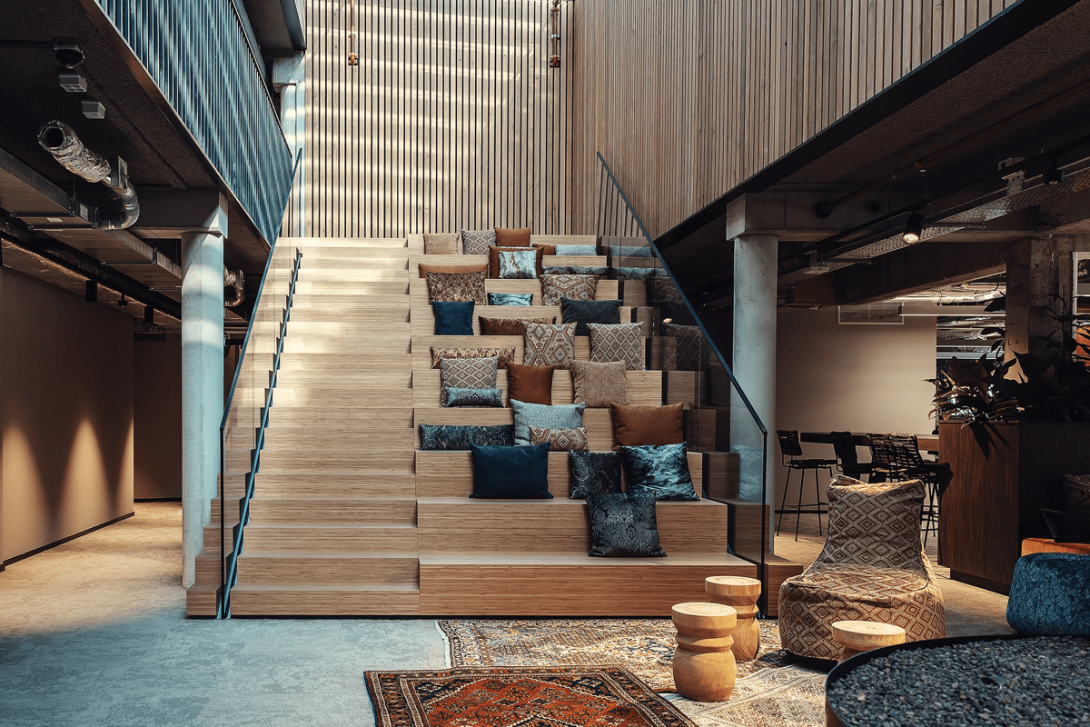 The big wooden staircase with cushions in the GoodHabitz office in Eindhoven