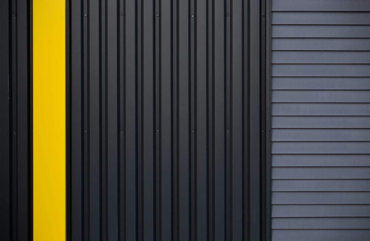 a black and yellow door with a yellow stripe