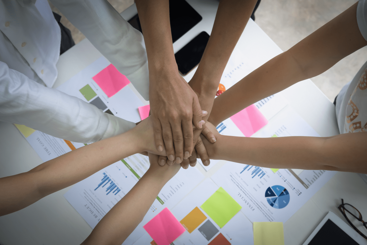 34584427-group-business-people-of-diverse-hands-together-joining.jpg