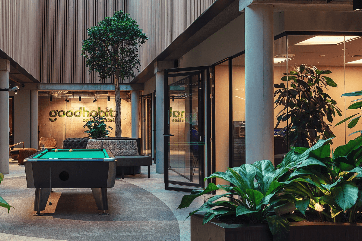 The pool table and plants in the GoodHabitz office in Eindhoven