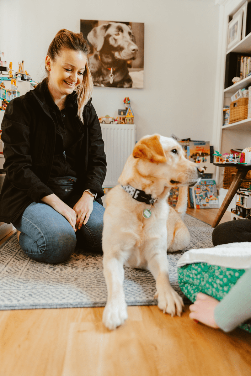 Instructor visiting dog and client at home