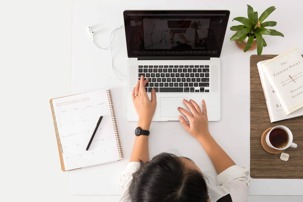 person using MacBook Pro.jpg person using MacBook Pro.jpg