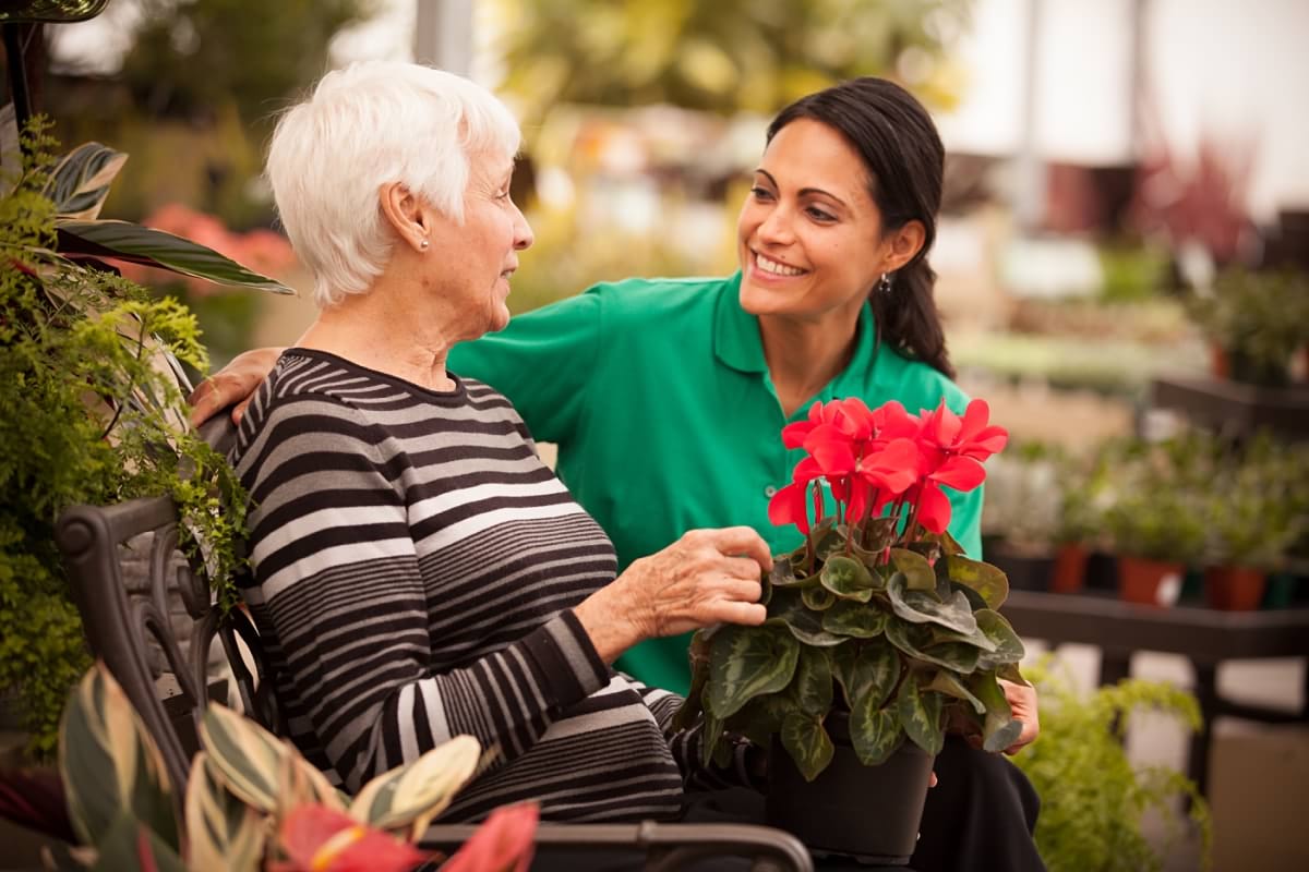 CareGiver supporting Client at garden centre.jpg