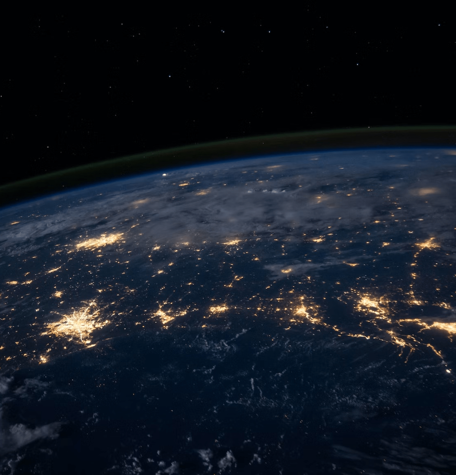 Earth from space at night with sporading sections of light from earth