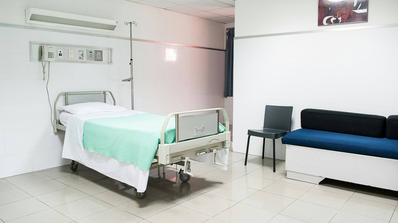 hospital bed near couch