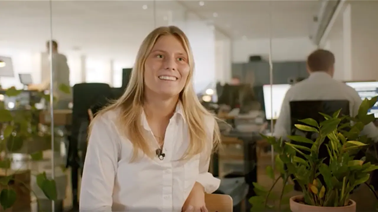 female employee at an office explaining her work